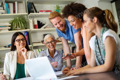 Preview: Group of successful happy multiethnic business people working as a team in office on meeting