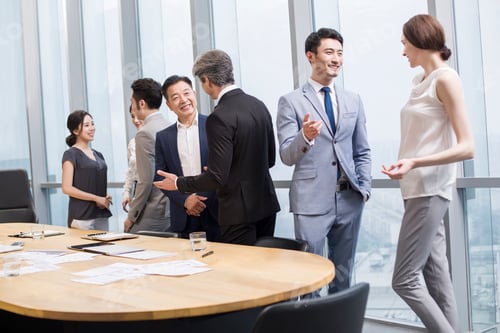 Preview: Business people talking in meeting room