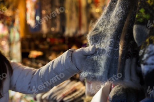 Preview: woman buying woolen socks at christmas market