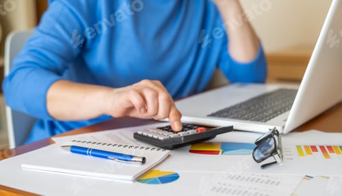 Preview: Businesswoman analyzing financial documents with calculator and charts for investment plan