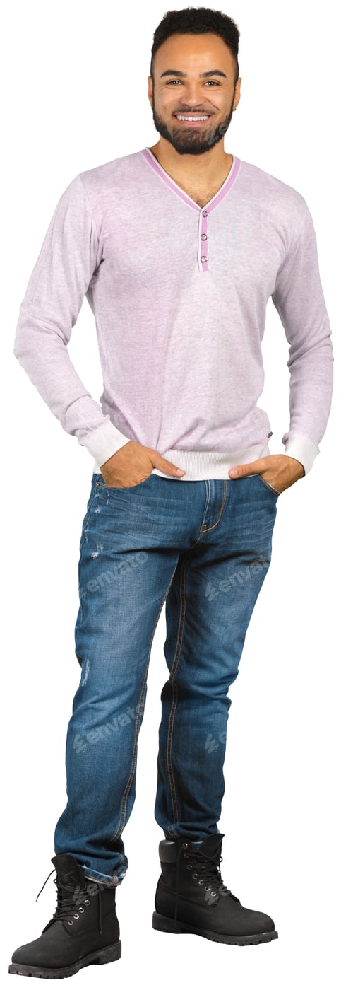 Preview: Man standing in casual clothing with hands in pockets in a studio setting