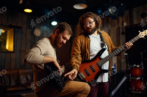 Preview: Hipster guys training play guitar enjoy rehearsal