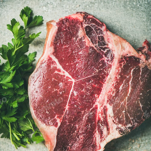 Preview: Flat-lay of raw uncooked dry-aged t-bone prime beef steak
