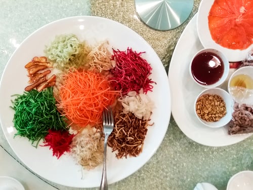 Preview: Yee Sang dish is a mixture of shredded vegetables, condiments and salmon