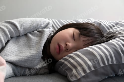 Preview: Child girl sleeping on bed