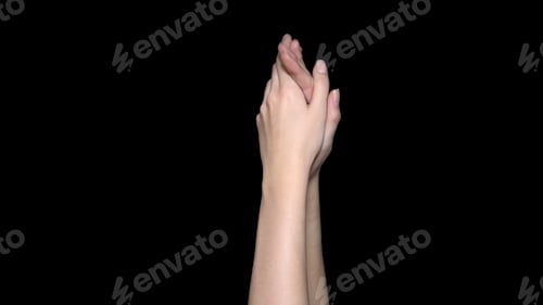Preview: Hands applauding isolated on a black background. Clapping hands over a black background