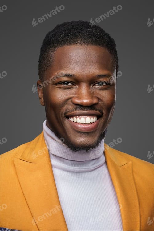 Preview: Stylish dark-skinned man wearing a yellow blazer