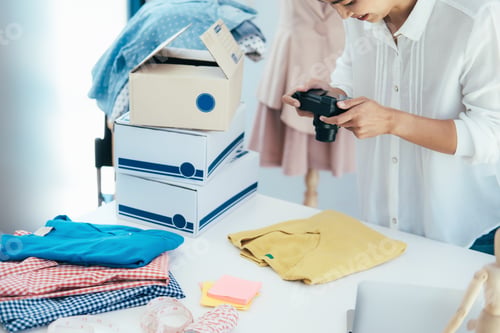Preview: Online seller owner take a photo of product