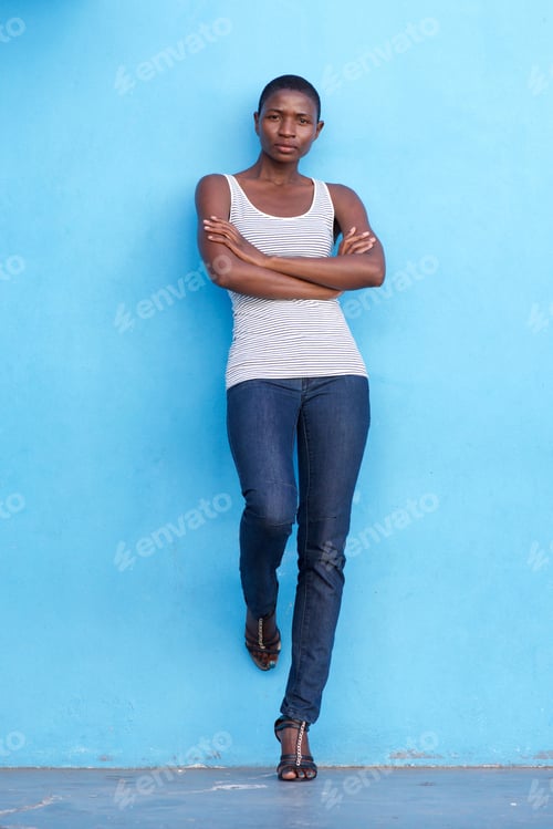 Preview: serious woman standing and staring with arms crossed