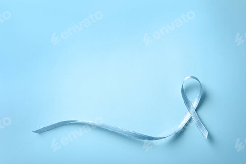 Preview: Blue ribbon on color background, top view. Cancer awareness