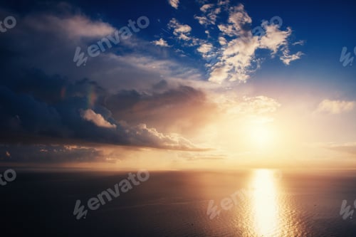 Preview: Fantastic view of the sky at sunset with cumulus clouds.