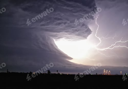 Preview: An explosive cloud-to-cloud bolt shoots from this tornadic supercell with highly structured rotation