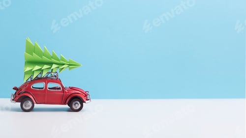 Preview: Red toy car with pine tree on the top on background
