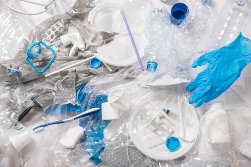 Preview: Background with a piile of different plastic waste