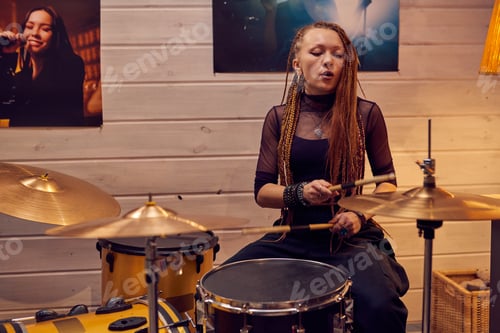 Preview: Woman Playing Drums in Cozy Rehearsal Room