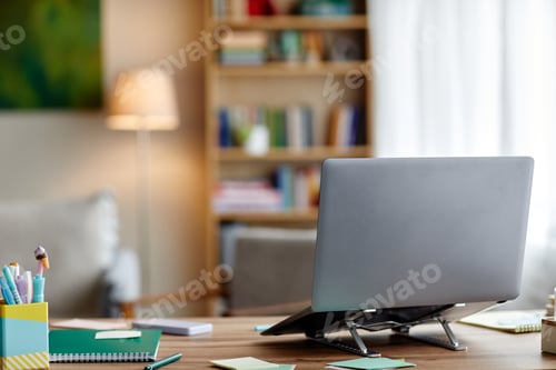 Preview: Modern Laptop Standing on Desk in Home Office Environment during Daytime