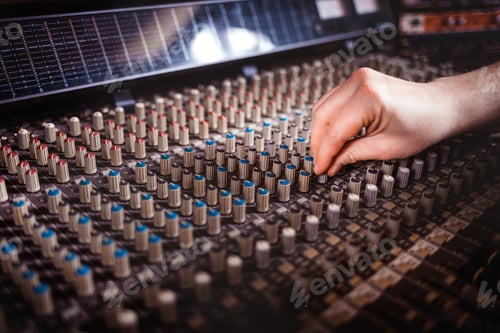 Preview: Recording studio mixing desk, music producer using soundboard