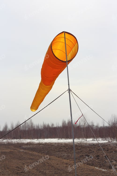 Windsock Blowing in a Rural Landscape