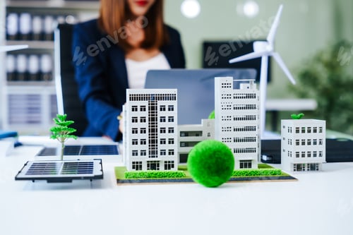 Preview: Close up Middle Aged Asian woman works at her desk, championing sustainability reducing carbon
