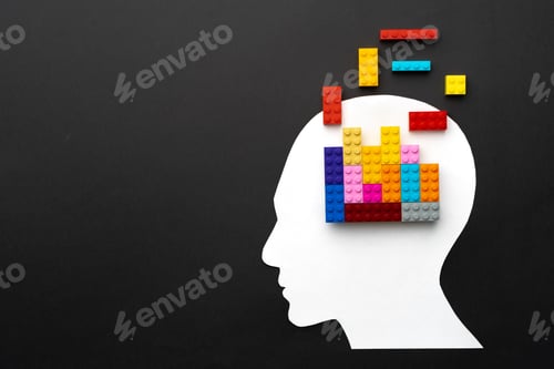 Preview: Papercut silhouette of human head with colorful constructor pieces
