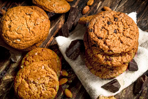 Preview: Delicious Cookies and Chocolate Pieces on Rustic Surface