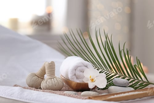 Preview: Beautiful spa composition on massage table in wellness center