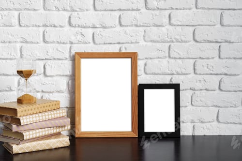 Preview: Books with picture frame on wooden table