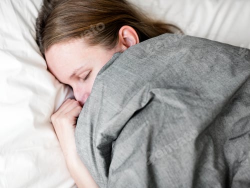 Preview: Caucasian woman sleeping in bed