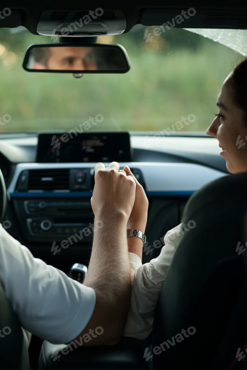 Preview: Beautiful couple on road trip holding hands - romantic adventure of man and woman traveling together