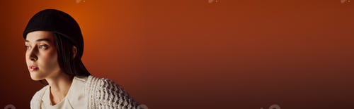 Preview: Stylish beautiful woman in a fashionable outfit against a warm, gradient background