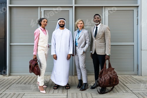 Preview: Group of multiethnic business people meeting an emirati businessman