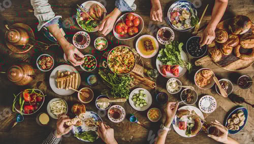 Flat-lay of Turkish family having traditional breakfast with various food