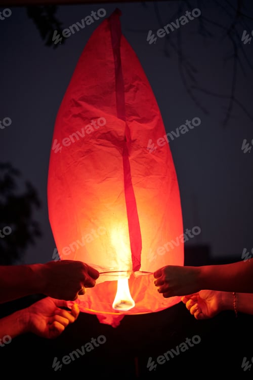 Preview: Couple Launching Lantern Into The Sky