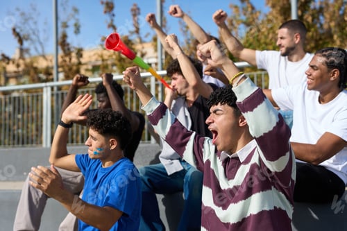 Preview: Sports fans cheering, raising fists at stadium