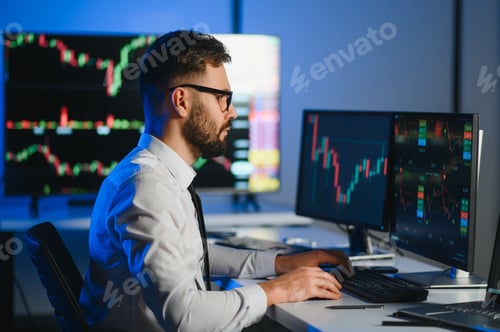 Preview: Crypto trader investor analyst looking at computer screen analyzing financial graph data on monitor