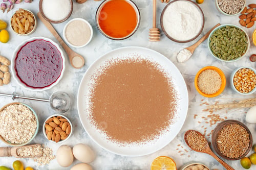 Preview: top view brown flour with eggs cereals seeds nuts and jelly on white background pie food bake milk