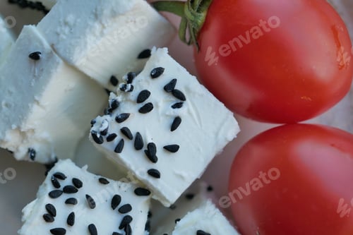 Preview: greek feta cubes with tomato diced soft cheese on plate