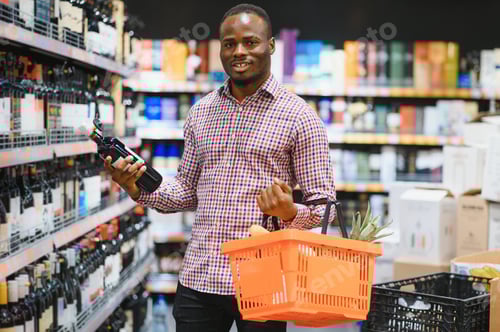 Preview: African American Man in a supermarket choosing a wine