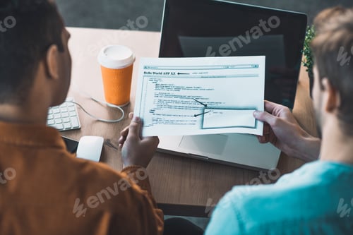 Top view of programmers being at work
