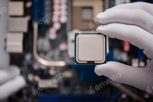 Preview: Gloved Hand of Technician Carefully Holding CPU
