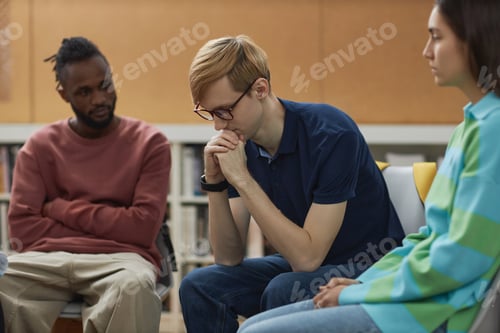 Preview: Troubled young man in support group circle