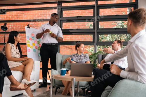 Preview: mature caucasian ceo businessman leader with diverse coworkers team executive managers group meeting