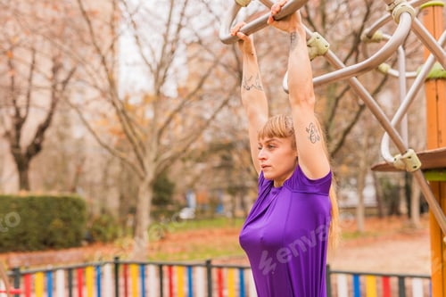 Preview: Calisthenics pull- up back exercise for cross fitness workout. Hispanic mid sportswoman athletic