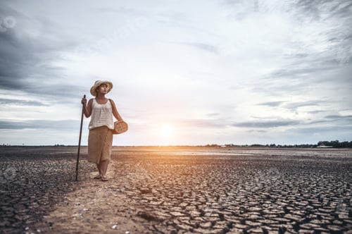 Preview: Women standing on dry soil and fishing gear, global warming and water crisis