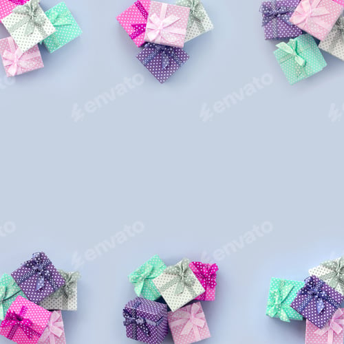 Preview: Piles of a small colored gift boxes with ribbons lies on a violet background