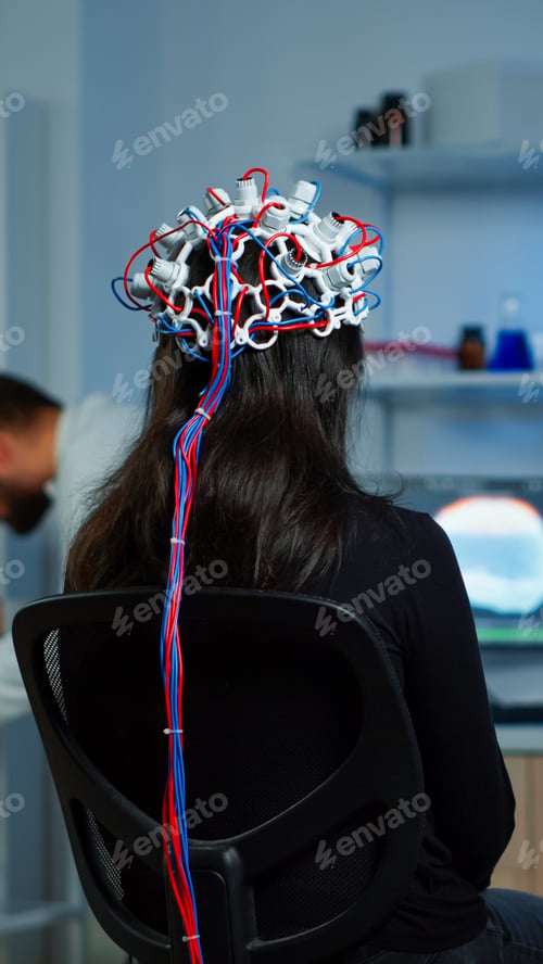 Preview: Back view of woman patient wearing performant eeg headset