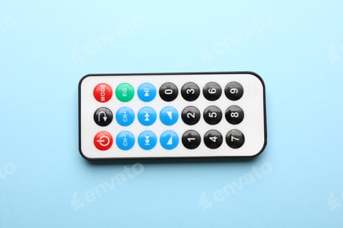 Preview: Remote control on light blue background, top view