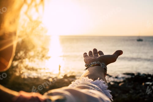 Preview: Sunset sunlight golden colors and ocean in background- woman with accessories