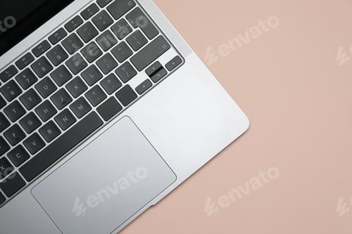 Preview: Modern laptop with keyboard on beige background, top view. Space for text
