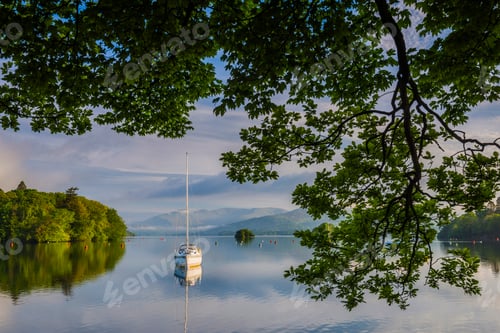Preview: Sailing boat floating on Lake Windermere at sunrise, Lake District National Park Landscape, Cumbria,